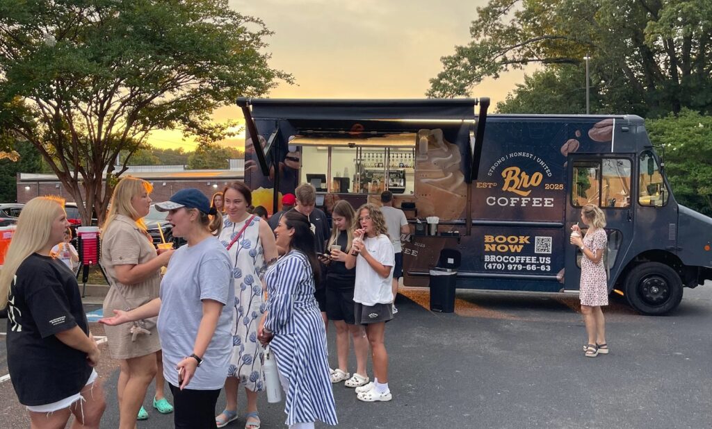 Guests lined up at the BRO COFFEE truck at sunset